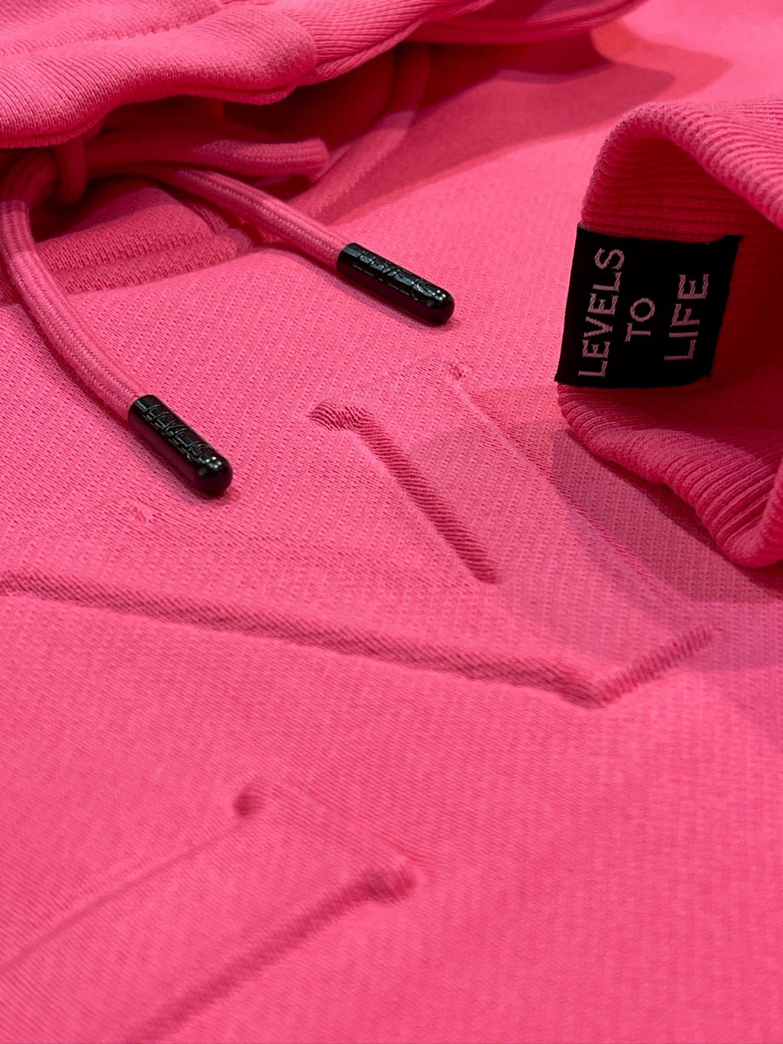 LEVELS, LLC Apparel & Accessories LVLS EMBOSSED CROP HOODIE | SASSY PINK