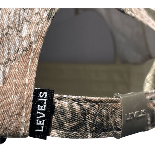 LUXE LEVELS CAMO TRUCKER HAT